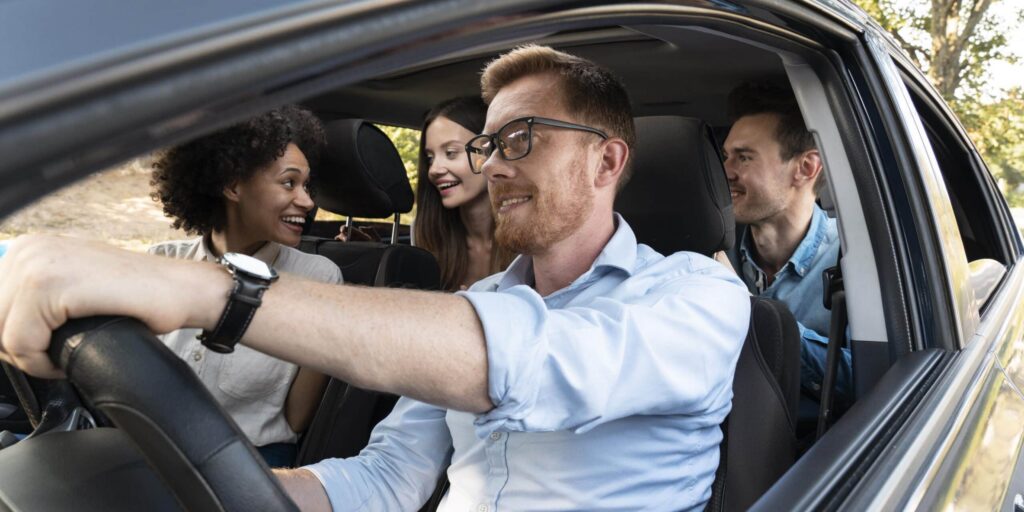 Friends in a car on a road trip
